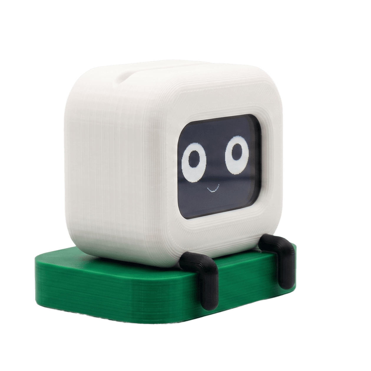 Shi+ne idle: a small white cube robot with a smile on a green base
